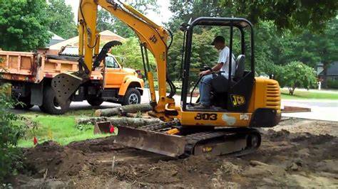 how to grade with a mini digger|digging with an excavator.